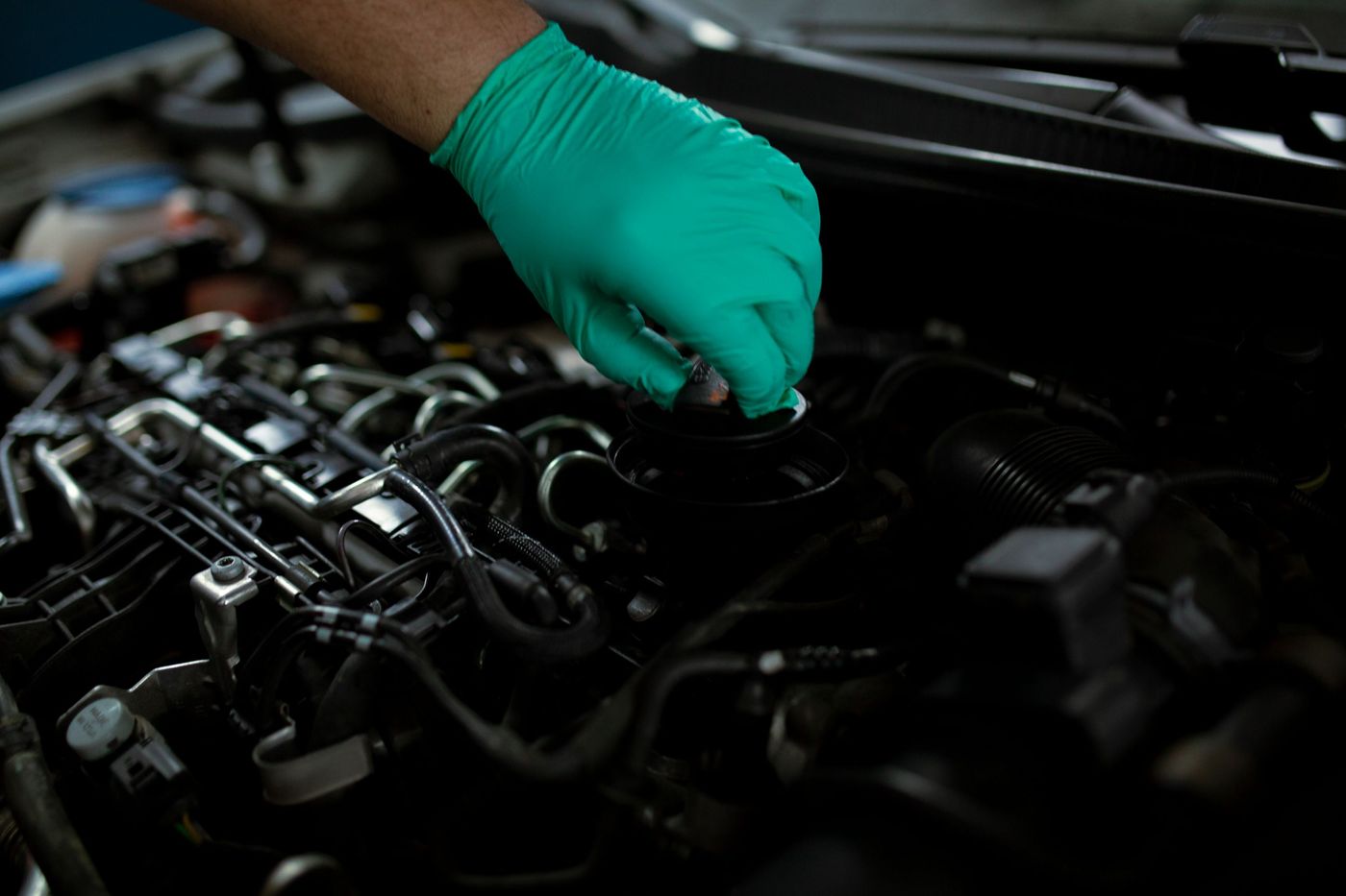 An oil service being carried out on an engine